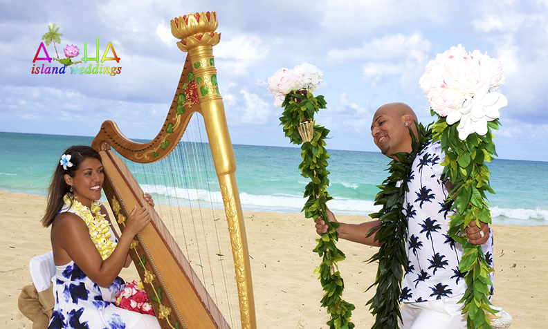 Stephanie playing a golden harp beside her husband at their 10-year vow renewal on the beach